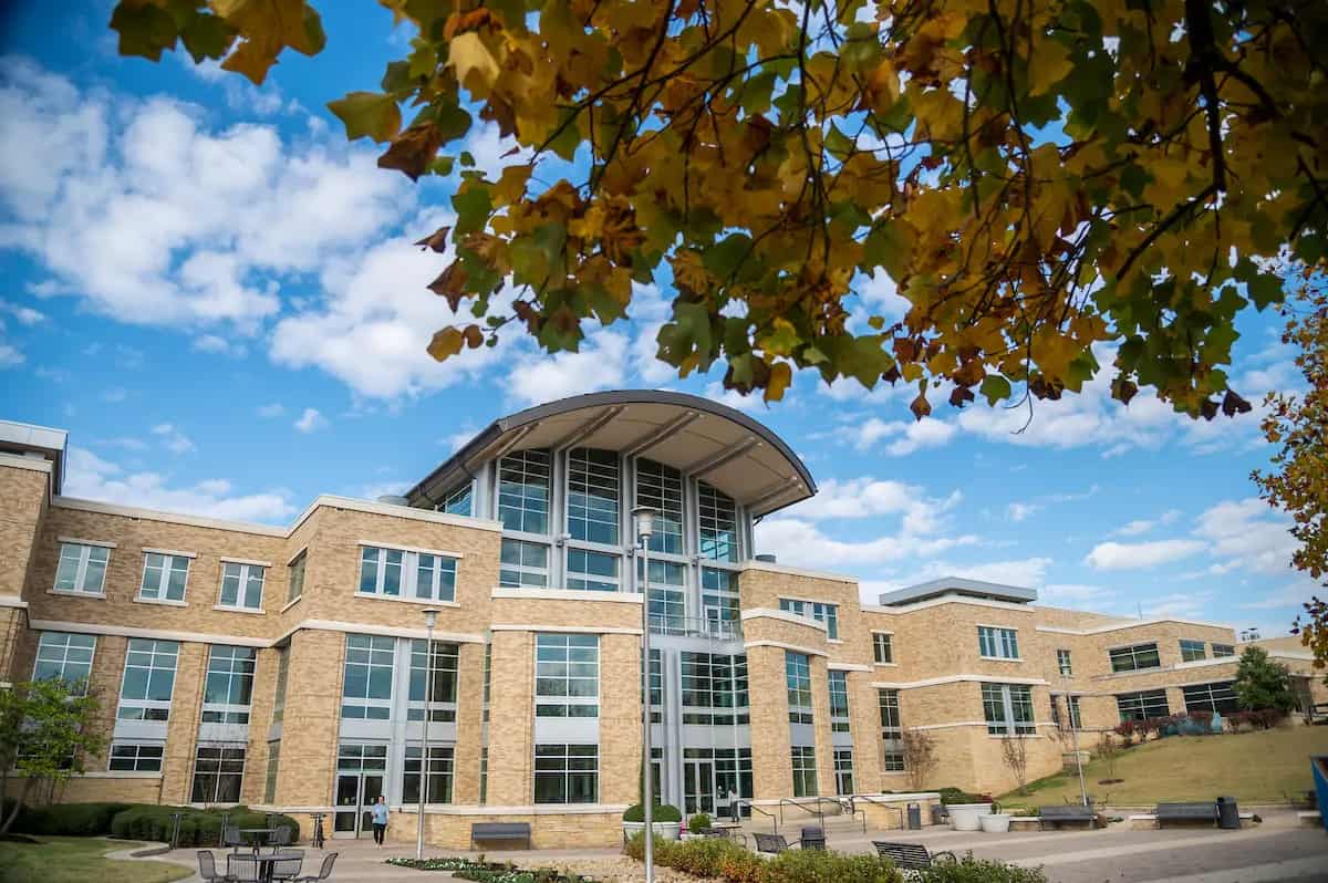 The student union at Arkansas State University under an autumn sky