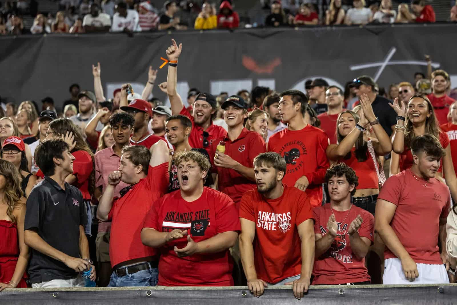 The A-State student section cheering during a football game