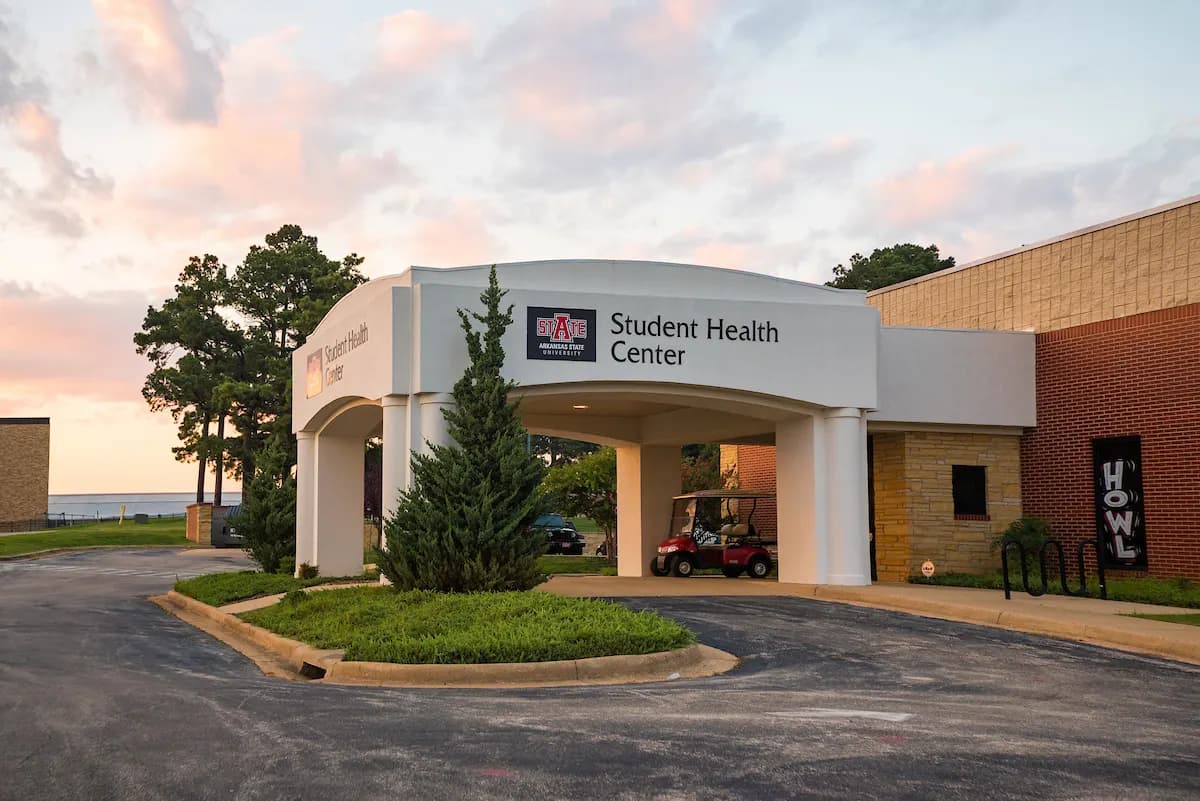 The A-State Student Health Center building at sunset