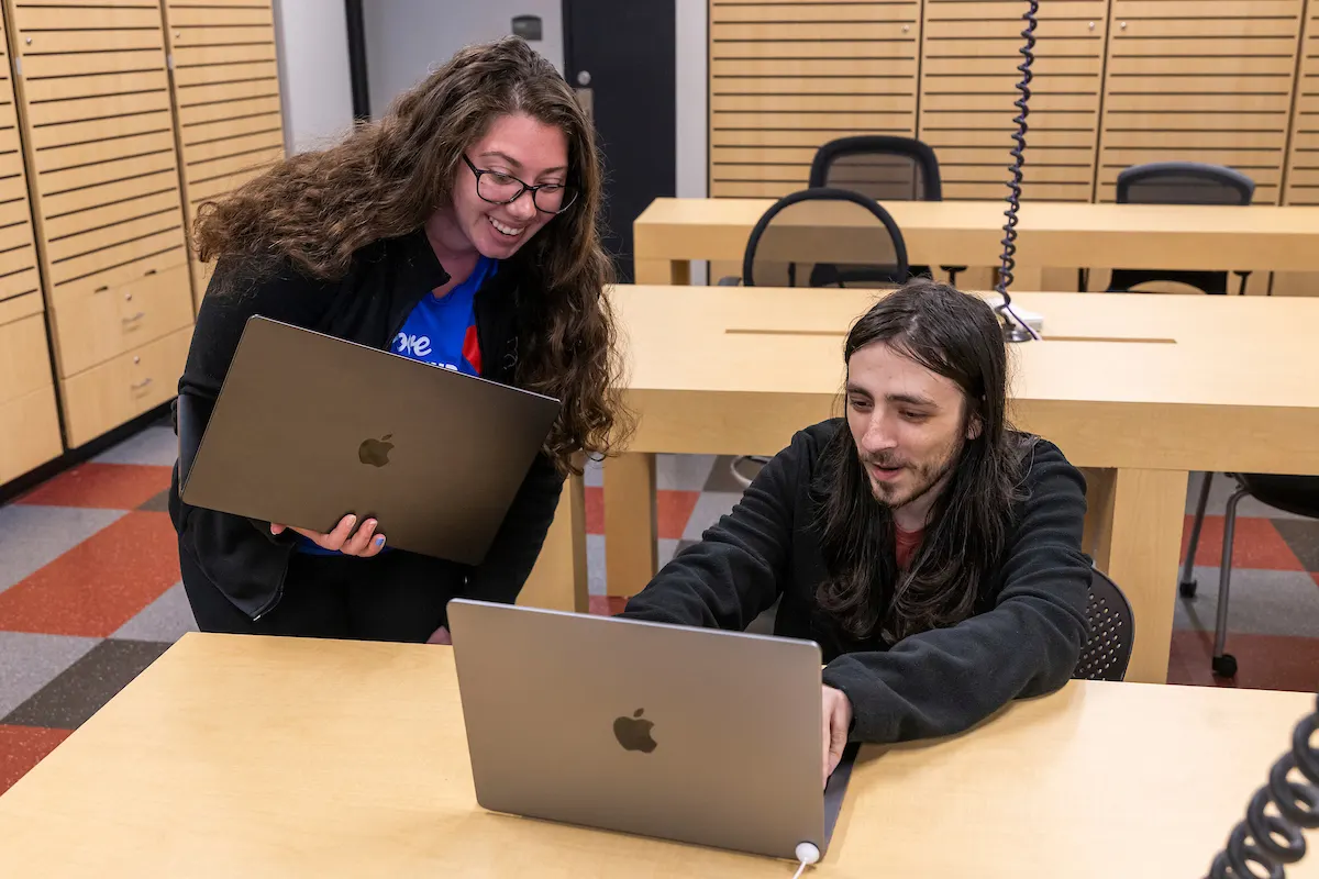 A-State students working on laptops in the campus IT center