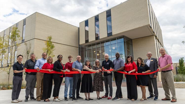 The ribbon-cutting ceremony for Windgate Hall of Art and Innovation at Arkansas State University, with university leaders and the Windgate Foundation